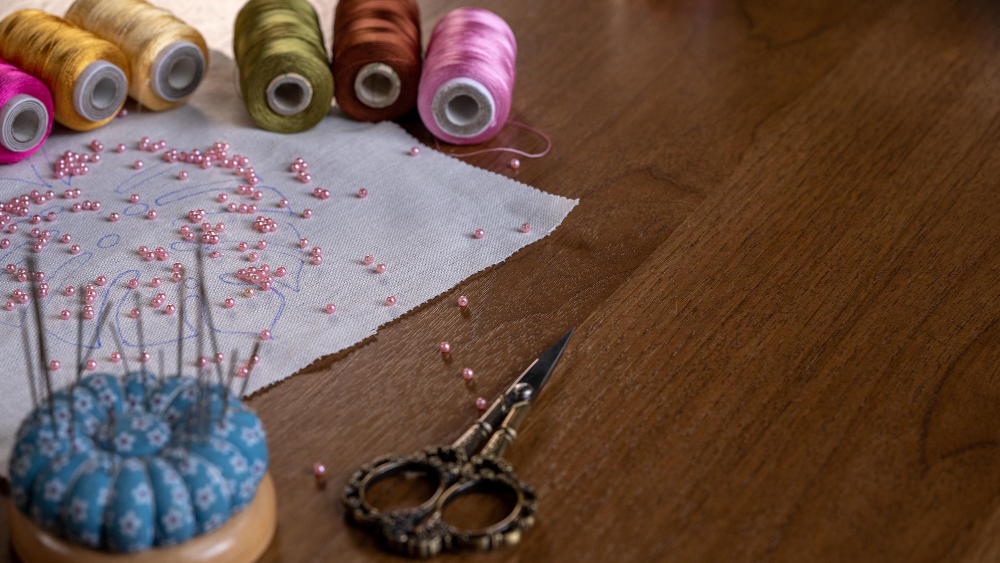 atelier workspace with threads and patterns